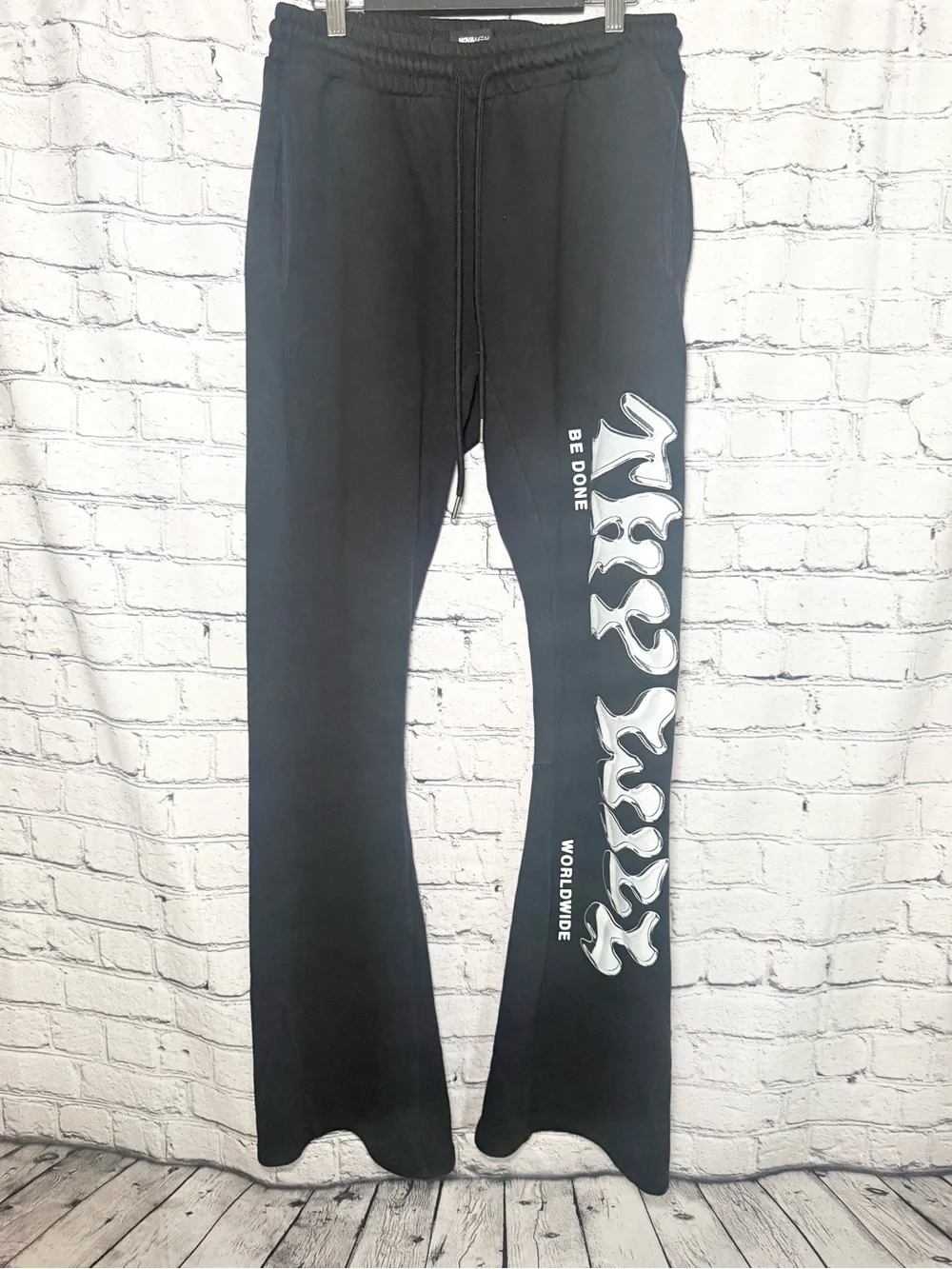 Novamen black graphic flare sweat pants. Size L